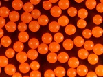Fluorescent Orange Polyethylene Microspheres Density 1.030g/cc<br>Spherical Polymer Particles Fluorescent in UV Light